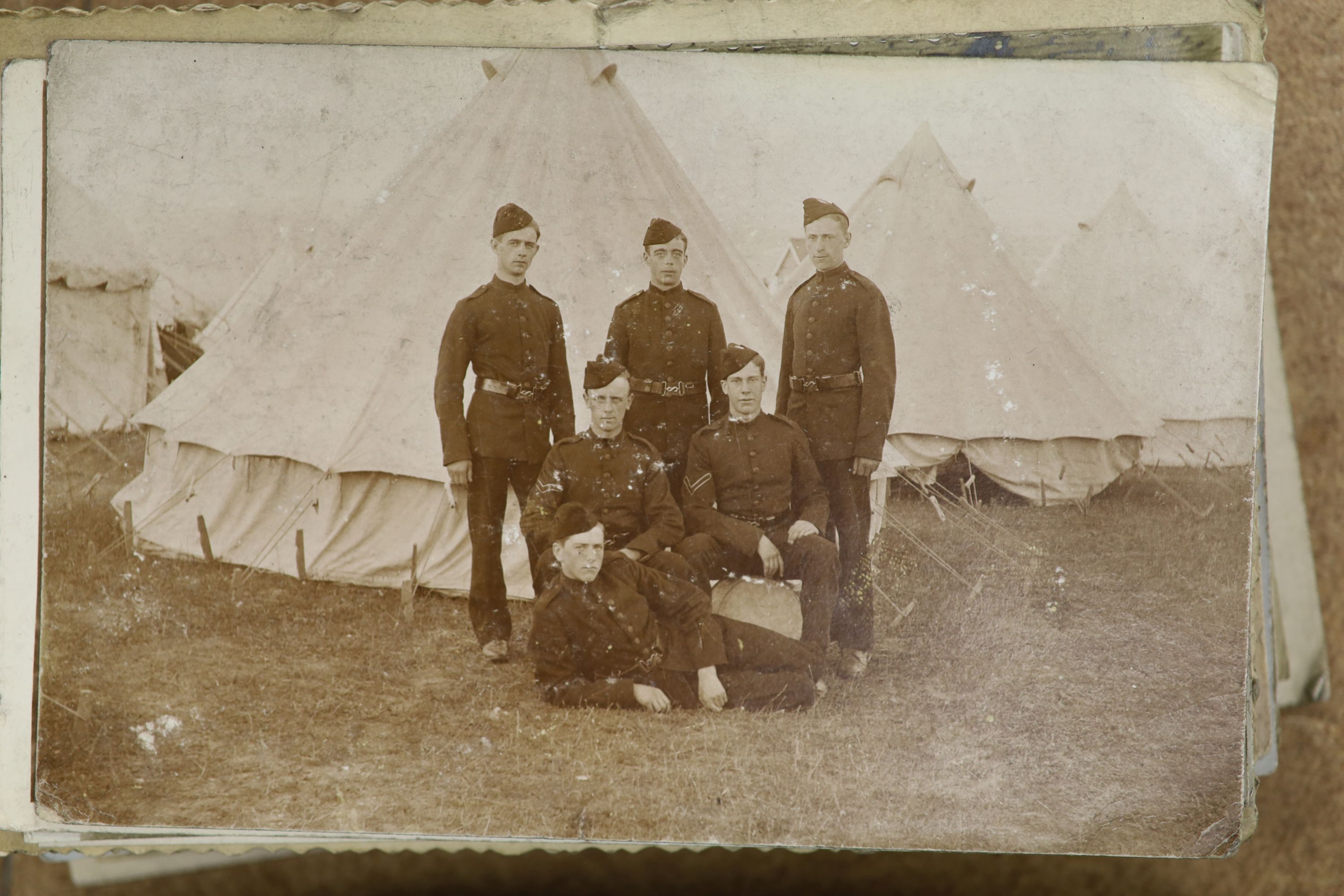 Three albums of photographs and a quantity of postcards inc. erotica.